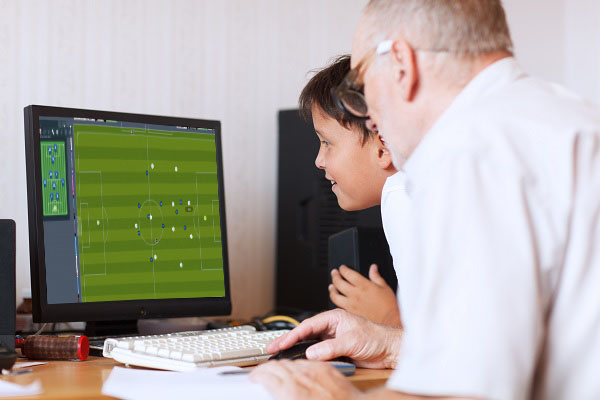 Grandfather and grandson playing FM